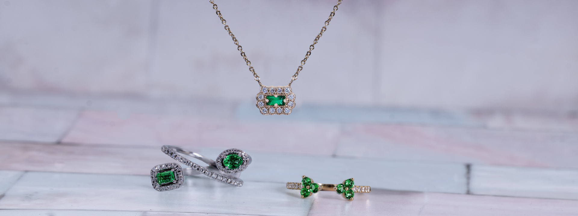 Emerald ring, pendant, and yellow gold emerald ring.