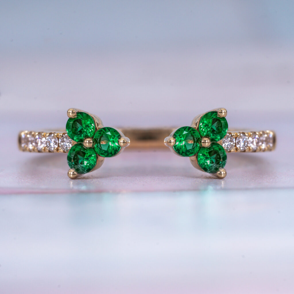 Yellow gold ring with emerald stones.